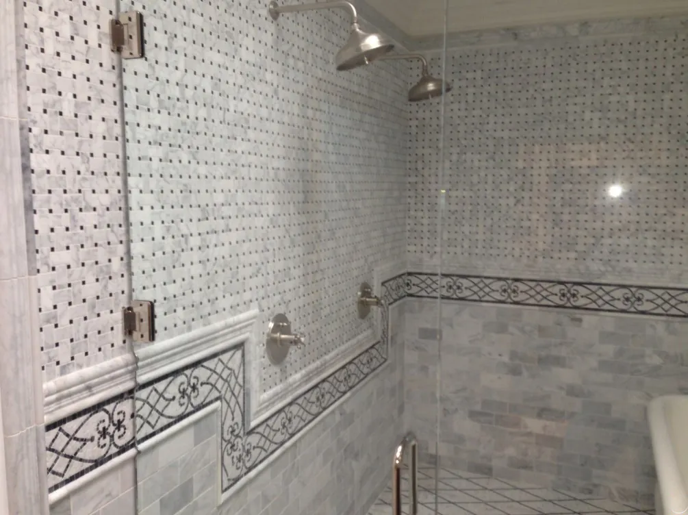 Marble basketweave mosaic shower with wrought-iron pattern tile border, Thousand Oaks