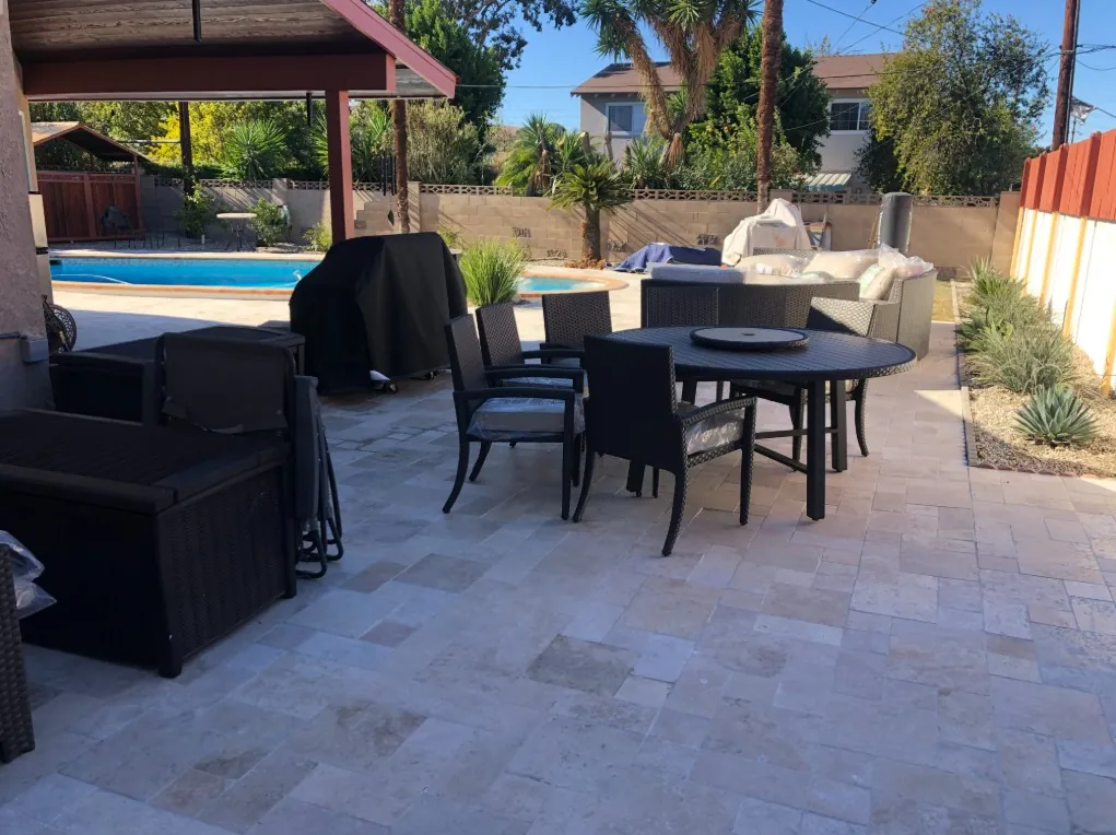 Travertine patio with outdoor dining area
